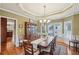Traditional dining room with hardwood floors, classic furnishings, and ample natural light at 4740 Arbor Meadows Dr, Cumming, GA 30040
