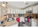 Well-lit kitchen features ample counter space, stainless steel appliances, and modern lighting at 4740 Arbor Meadows Dr, Cumming, GA 30040