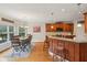 Open-concept kitchen and dining area with hardwood floors and natural lighting at 4740 Arbor Meadows Dr, Cumming, GA 30040