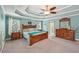 Spacious primary bedroom suite with a tray ceiling, ceiling fan, and generous natural light at 4740 Arbor Meadows Dr, Cumming, GA 30040