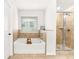 Bathroom with a soaking tub, shower, tile surround, and natural light at 4758 Sultana Way, Atlanta, GA 30331