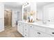 Bathroom featuring double sinks, granite countertops and a glass enclosed shower at 4758 Sultana Way, Atlanta, GA 30331