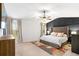 Spacious bedroom with dark accent wall, bed, area rug and natural light at 4758 Sultana Way, Atlanta, GA 30331