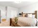 Bright bedroom with a wooden bed frame and neutral colored carpet at 4758 Sultana Way, Atlanta, GA 30331