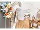 Bright entryway showcasing hardwood floors, high ceilings, elegant staircase, and a view to a modern kitchen at 4758 Sultana Way, Atlanta, GA 30331