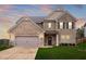 Lovely brick home with covered entry, two-car garage, and mature landscaping at 4758 Sultana Way, Atlanta, GA 30331