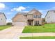 Charming two-story brick home with a well-manicured lawn and attached two car garage at 4758 Sultana Way, Atlanta, GA 30331
