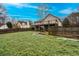 Backyard featuring partial home view with two-story deck and lawn at 218 Pine Needle Trl, Villa Rica, GA 30180