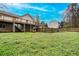 A backyard featuring a partial view of the deck with a grass covered yard at 218 Pine Needle Trl, Villa Rica, GA 30180