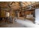 Spacious unfinished basement ready for customization with visible beams and cement floor at 218 Pine Needle Trl, Villa Rica, GA 30180