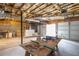 Unfinished basement with exposed ceiling and concrete walls at 218 Pine Needle Trl, Villa Rica, GA 30180