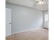 Large bedroom with neutral carpet and lots of natural light at 218 Pine Needle Trl, Villa Rica, GA 30180
