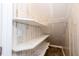This closet features neutral walls with white shelving, providing ample storage at 218 Pine Needle Trl, Villa Rica, GA 30180