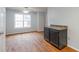 Bright dining room features hardwood floors and a large window, complemented by a stylish ceiling fan at 218 Pine Needle Trl, Villa Rica, GA 30180
