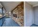 The front porch features stacked stone accents and painted wood flooring at 218 Pine Needle Trl, Villa Rica, GA 30180