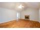 Living room with hardwood floors, vaulted ceiling and stone fireplace at 218 Pine Needle Trl, Villa Rica, GA 30180