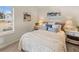 Bright bedroom featuring a queen-sized bed and neutral decor at 2201 Cormac St, East Point, GA 30344