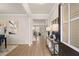 Bright entryway with hardwood floors, modern decor, and an inviting view into the home at 2201 Cormac St, East Point, GA 30344