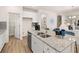 Spacious kitchen island with granite countertops, stainless steel appliances, and lots of cabinet space at 2201 Cormac St, East Point, GA 30344