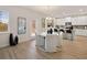 Bright kitchen dining area with white cabinetry, stainless steel appliances, and a cozy dining nook at 2201 Cormac St, East Point, GA 30344