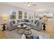 Bright living room featuring a comfortable sectional sofa and a decorative rug at 2201 Cormac St, East Point, GA 30344