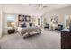 Spacious main bedroom featuring large windows for natural light, carpet flooring, and vaulted ceilings at 2201 Cormac St, East Point, GA 30344