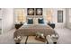 Comfortable main bedroom featuring a large bed, carpet flooring, and windows with natural light at 2201 Cormac St, East Point, GA 30344