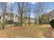 Spacious backyard with play equipment and mature trees at 4340 Boxwood Trl, Ellenwood, GA 30294