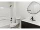 Classic bathroom features a tub and shower combination with a modern black sink vanity at 4340 Boxwood Trl, Ellenwood, GA 30294
