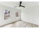 Bedroom featuring wood-look floors, neutral walls and large windows at 4340 Boxwood Trl, Ellenwood, GA 30294
