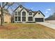 Traditional two-story home with well-manicured lawn at 4340 Boxwood Trl, Ellenwood, GA 30294