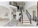 Elegant foyer with a staircase, hardwood floors, and an open concept design, creating a bright and welcoming space at 4340 Boxwood Trl, Ellenwood, GA 30294