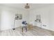 Bright home office featuring neutral walls, modern decor, wood-look floors, and ample natural light perfect for productivity at 4340 Boxwood Trl, Ellenwood, GA 30294