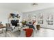 Inviting living room with a fireplace, neutral tones, modern decor, and an abundance of natural light creating a comfortable atmosphere at 4340 Boxwood Trl, Ellenwood, GA 30294