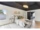 Bright main bedroom featuring a decorative ceiling, a chandelier and an ensuite bathroom at 4340 Boxwood Trl, Ellenwood, GA 30294