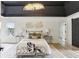 Bright main bedroom featuring a decorative ceiling, a chandelier and an ensuite bathroom at 4340 Boxwood Trl, Ellenwood, GA 30294