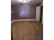 Bedroom with laminate flooring, natural light, and an interior door at 550 Lake Dr, Hapeville, GA 30354