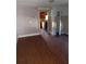 Living room featuring laminate flooring and doorway leading to the kitchen at 550 Lake Dr, Hapeville, GA 30354