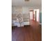 Living room showcasing laminate floors, built-in shelving, and doorway to another room at 550 Lake Dr, Hapeville, GA 30354