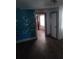 Living room with laminate flooring and doorway leading to the next room at 550 Lake Dr, Hapeville, GA 30354