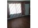 Living room with laminate flooring, natural light, and an exterior door at 550 Lake Dr, Hapeville, GA 30354