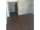 Living room with laminate floors and an open doorway leading to kitchen at 550 Lake Dr, Hapeville, GA 30354