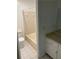 Tiled bathroom with a shower-tub combo and vanity at 1173 Mill Ridge Dr, Lawrenceville, GA 30045