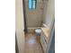 A tiled bathroom with a shower-tub combo and vanity at 1173 Mill Ridge Dr, Lawrenceville, GA 30045