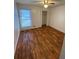 Bedroom with hardwood floors, window and ceiling fan at 1173 Mill Ridge Dr, Lawrenceville, GA 30045