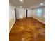 Bedroom with hardwood floors, neutral walls, a window and closet at 1173 Mill Ridge Dr, Lawrenceville, GA 30045