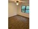 Laminate floors, ceiling fan, and a window with a view of the woods at 1173 Mill Ridge Dr, Lawrenceville, GA 30045