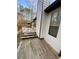 Side exterior of the home with an upper level deck and stairs at 1173 Mill Ridge Dr, Lawrenceville, GA 30045