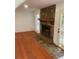 Living room featuring a stone fireplace and hardwood floors at 1173 Mill Ridge Dr, Lawrenceville, GA 30045