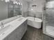 Bathroom with a walk-in shower, soaking tub, and double vanity at 2548 Loghaven Nw Dr, Atlanta, GA 30318